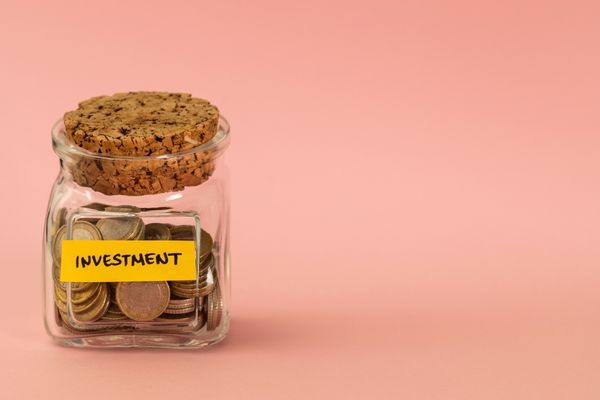 jar of coins labeled investment