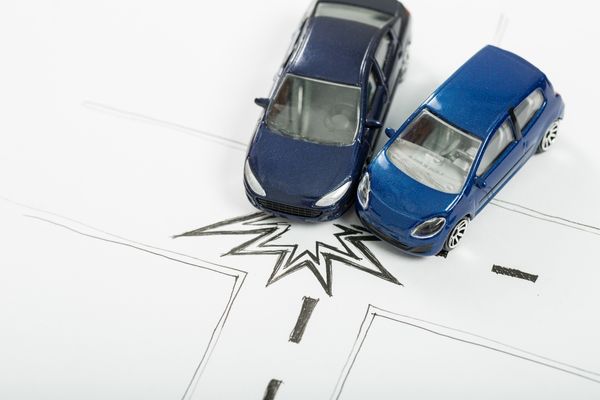cars and drawing signifying collision